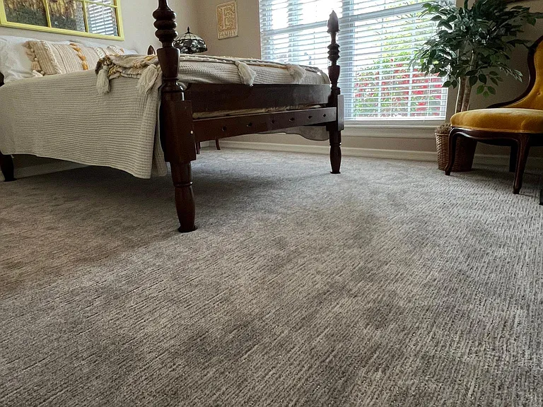 Guest Bedroom with antique bed and new carpet