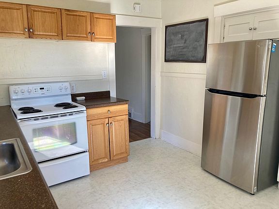 New fridge and updated electric and microwave are provided in the kitchen.