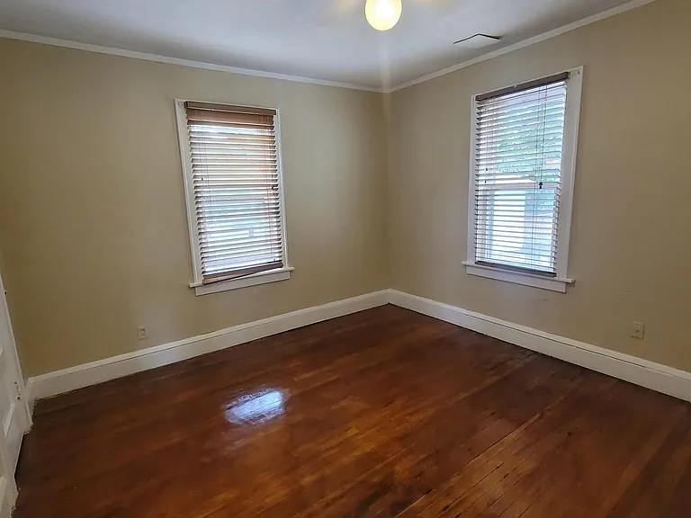 Guest bedroom with walk-in closet or office