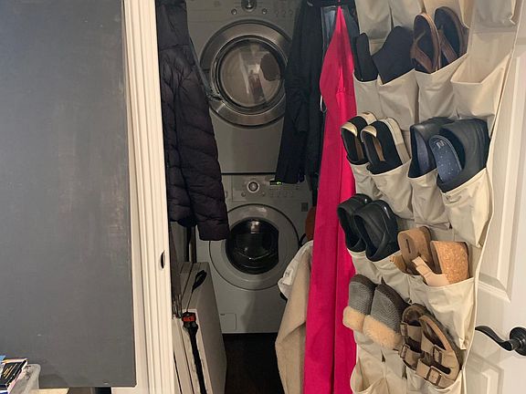 stacked washer dryer in the closet