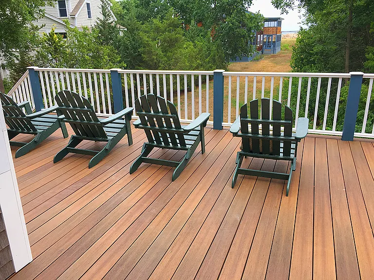 Large ocean-facing deck that wraps all the way around to the back and detached Studio. There is also an outdoor hot-cold shower at the bottom of the stairs to the left.