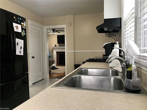 View from kitchen into the living room ... door leads down to the full, walkout basement.