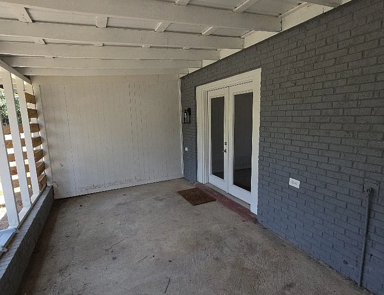 BIG covered porch with view to backyard