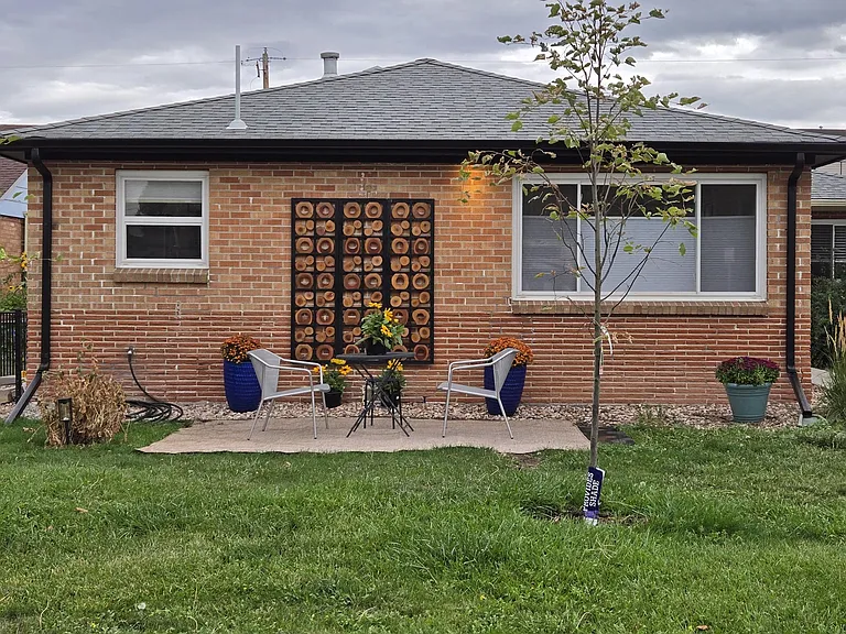 Enjoy your morning coffee or evening cocktail on this small patio. The exterior of the house is well lite all the way round it. Has a fenced backyard.