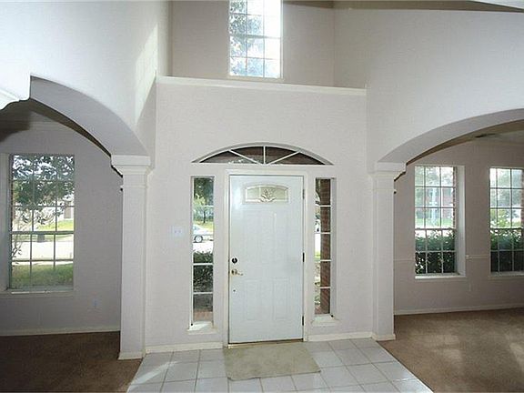 Spacious entrance open to the formal dining and study