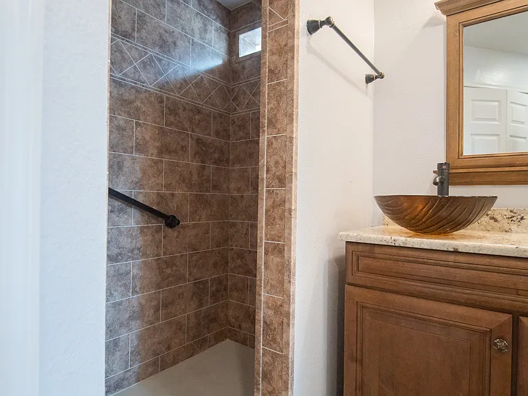 Hand rails in the shower
Rain shower + hand held shower head