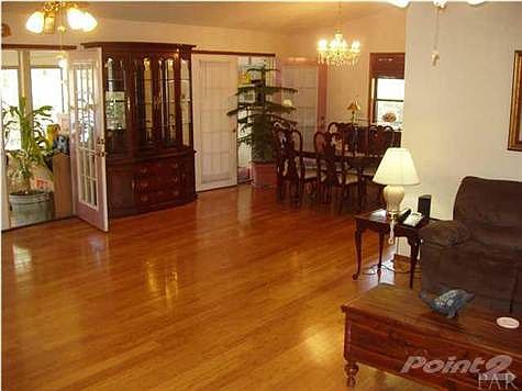 LIVING/DINING TOWARD FRENCH DOORS TO THE SUNPORCH