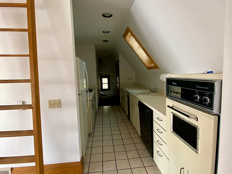 Looking into kitchen from edge of dining room.