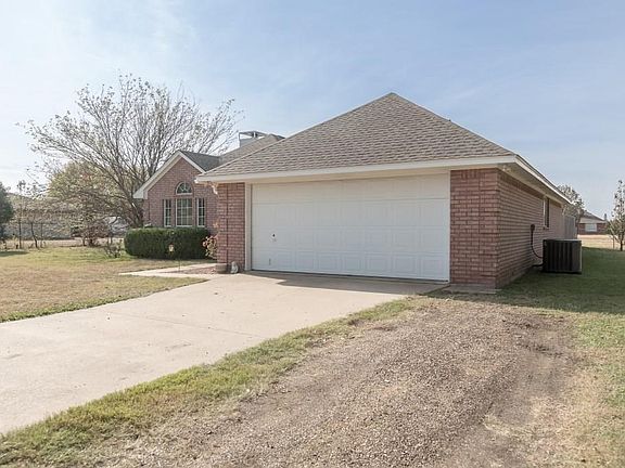 Extra long drive way with additional space for more parking.