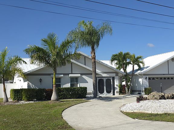 Great curb appeal, wrap around driveway with plenty of of street parking for guests
