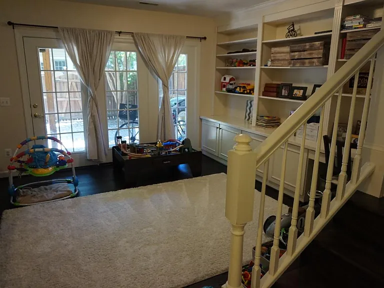 Basement or family room with access to fenced in patio