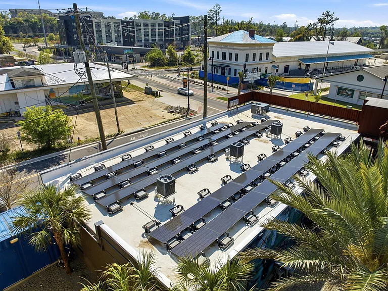 This solar array is sized to fully power the three apartments it sits atop.