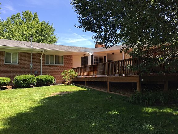 Back of house with deck