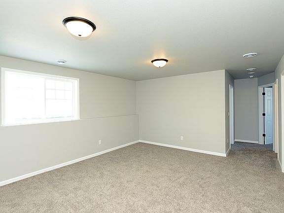 Lower level offers family room, two bedrooms, laundry and full bath.