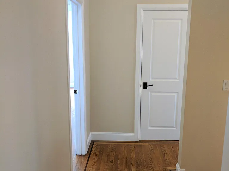 Upper Hallway bedroom 4 on left, laundry ahead