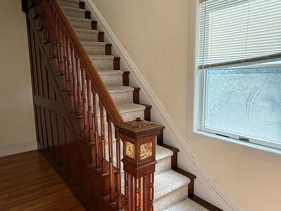 staircase to apartment with separate entrance from porch