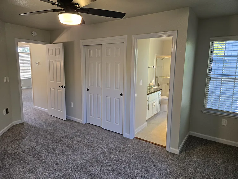 Spacious second primary suite with a private en-suite bath, generous closet space, and a bright window nook that's perfect for a reading chair, desk, or vanity.