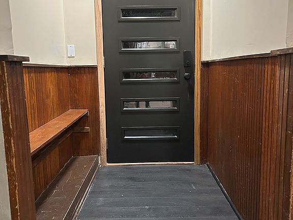 Front entry is ready to store boots, shoes, and jackets.