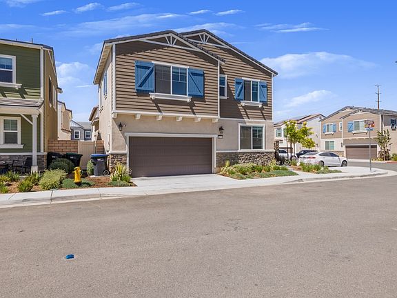 Modern two-story corner home with a two-car garage, landscaped front yard, and stunning curb appeal. Located in North Menifee's "The Village" community, offering privacy, convenience, and easy access to local amenities.