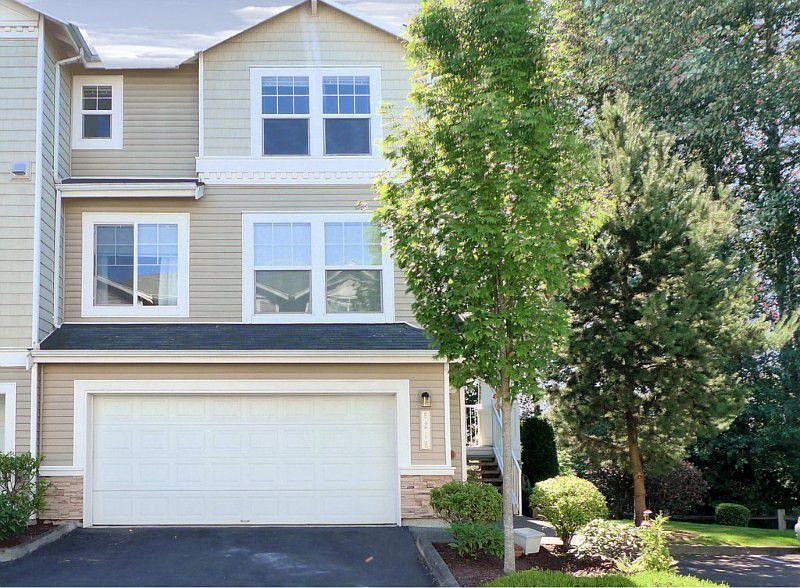 Wonderful Town home located on an end, with a lush greenbelt on onside and a play field behind.