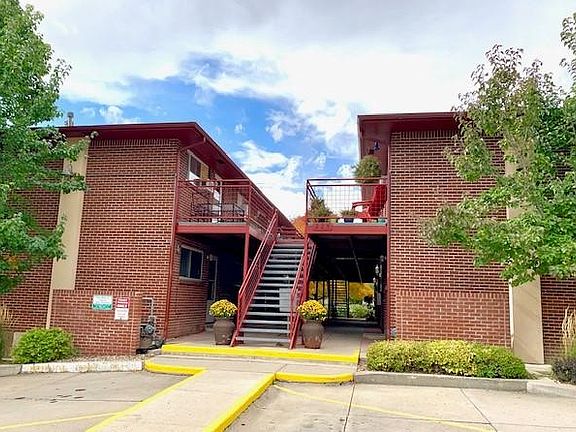 Front of building with parking