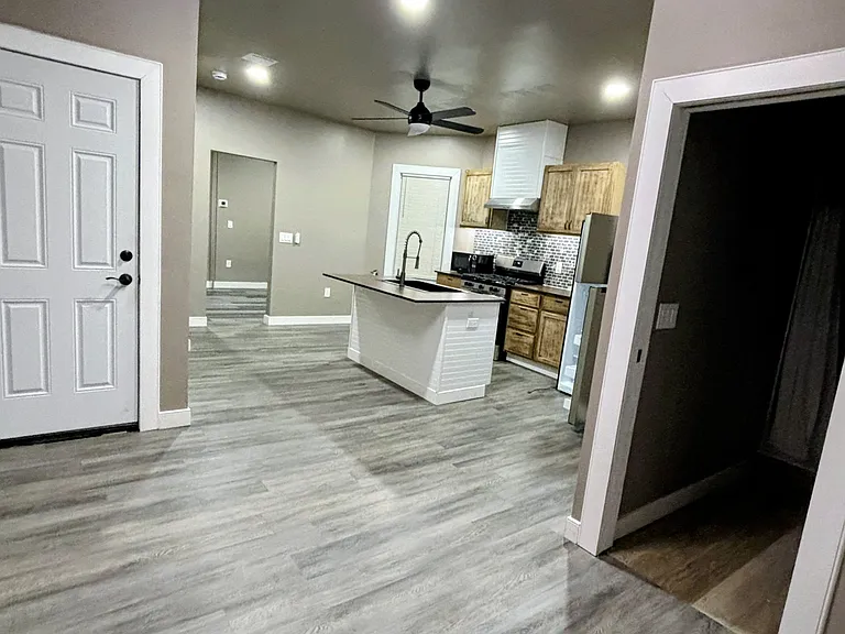 Island kitchen. New floors. Pocket sliding door into bathroom