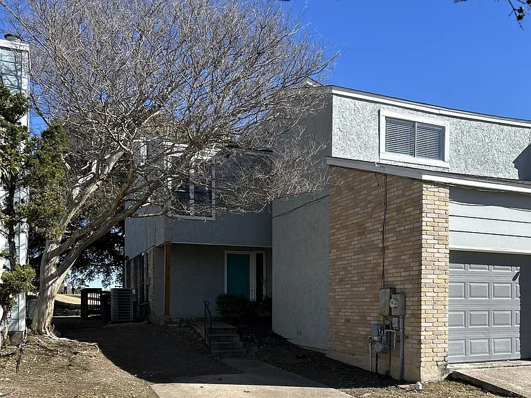 Guest parking space and entry to the home.