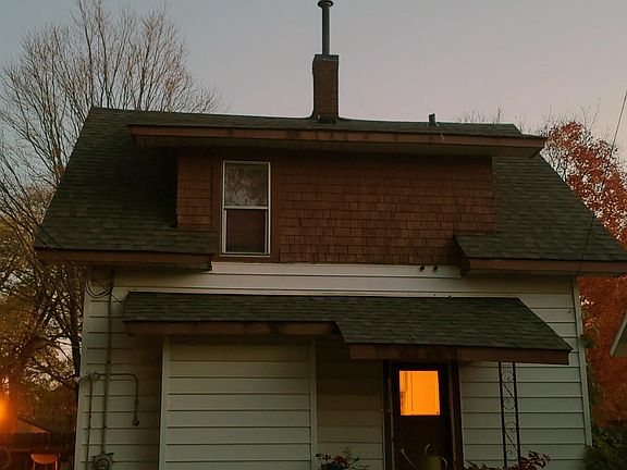 back of house - door is off kitchen and leads to garage