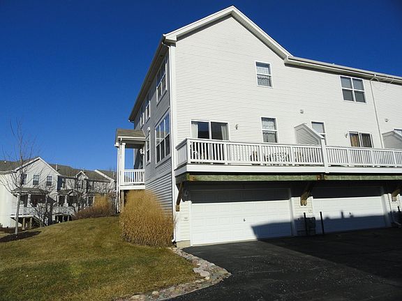 Deck and 2-Car Garage. Higher roof line on this end unit allows for vaulted ceilings upstairs!