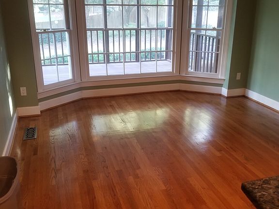 Kitchen window looking at screen porch and back yard