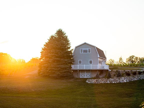 This property is a barn-style structure with vineyard and lake views