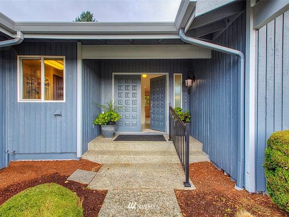 Inviting covered double door entry. 