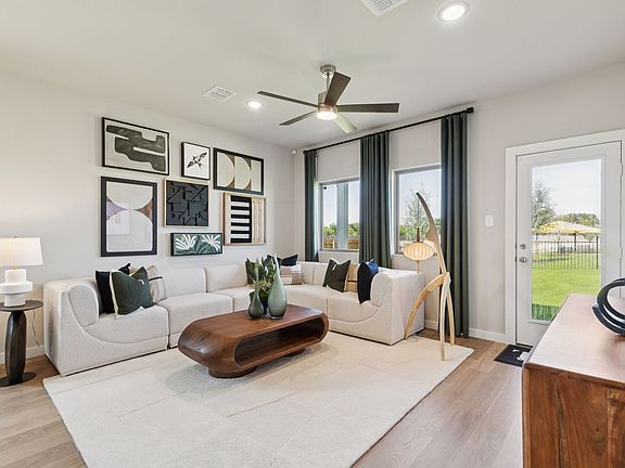 Living Room in the Magnolia home plan by Trophy Signature Homes - REPRESENTATIVE PHOTO