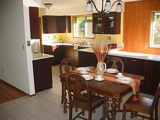 A portion of the dining room is here viewed from the the deck door.