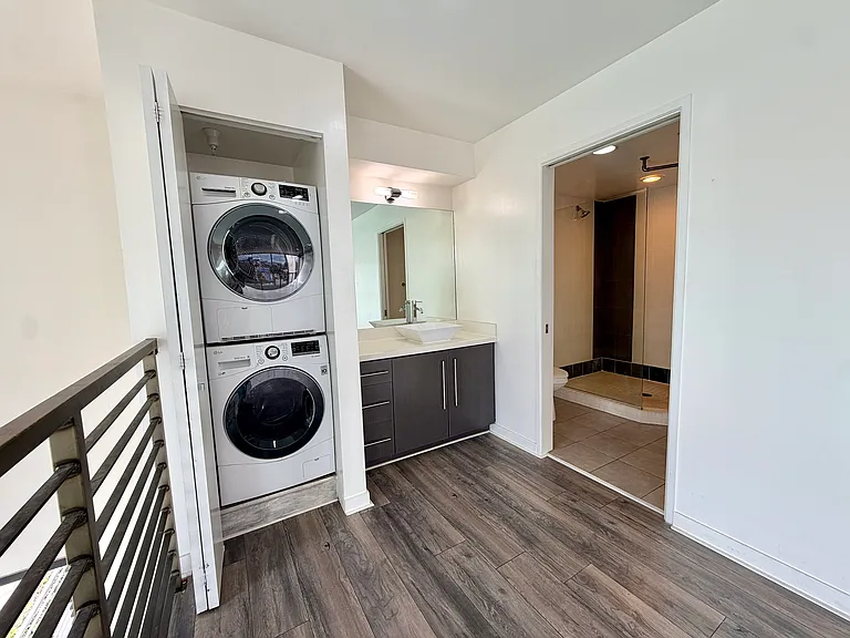 Primary bathroom with in-unit washer dryer.