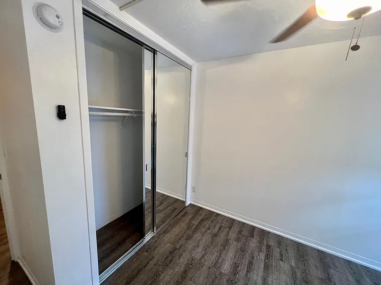 Second bedroom with large closet and ceiling fan
