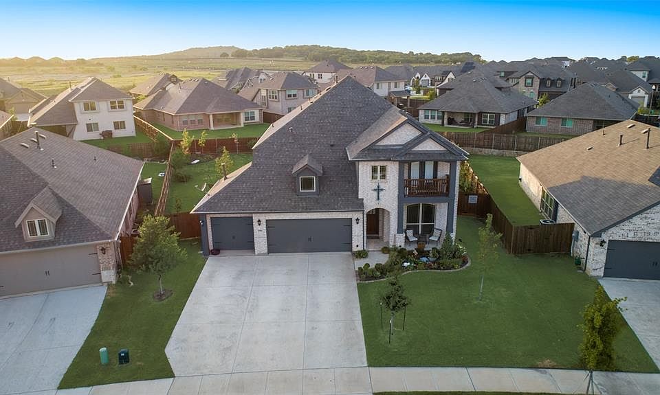 Extra - wide lot with 3 car garage.