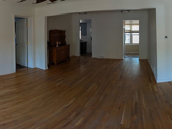 Upon stepping through the front entryway an open family room leads to a dining area