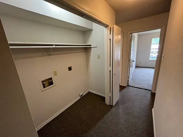 utility area with hook-ups for washer and electric dryer