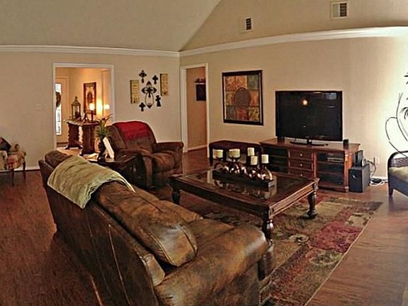 Spacious living with gorgeous wood laminate & tall ceilings!