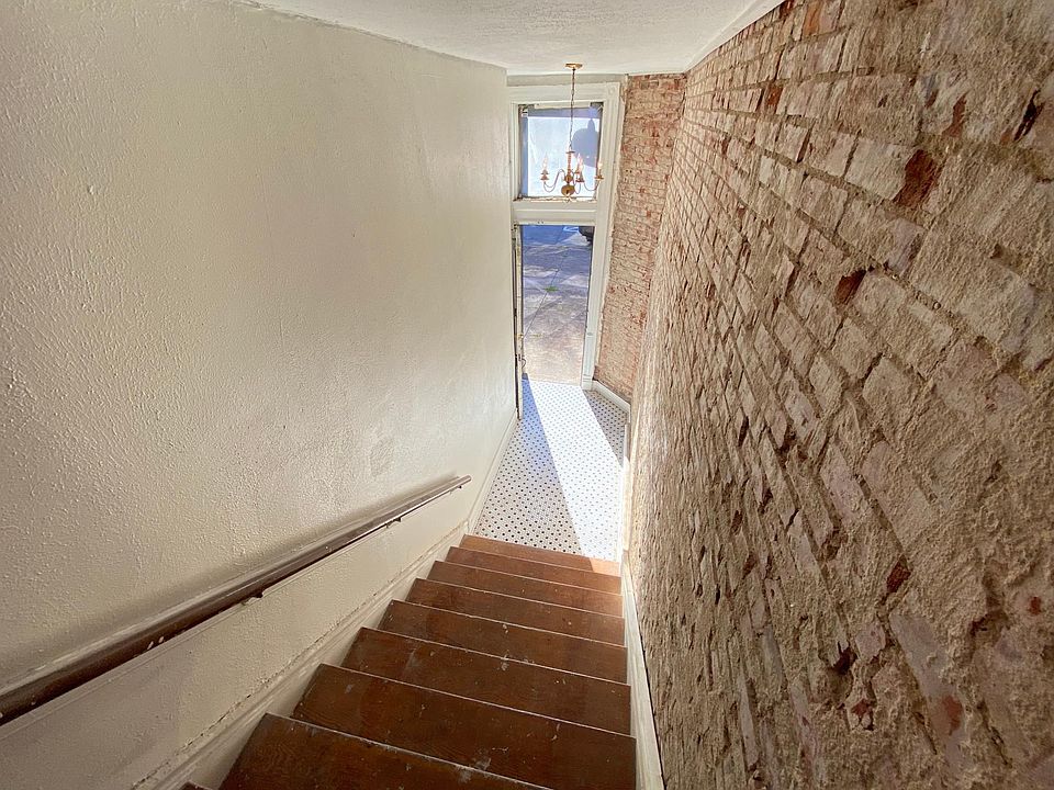 Looking down the stairway to the front entrance from the entry landing.