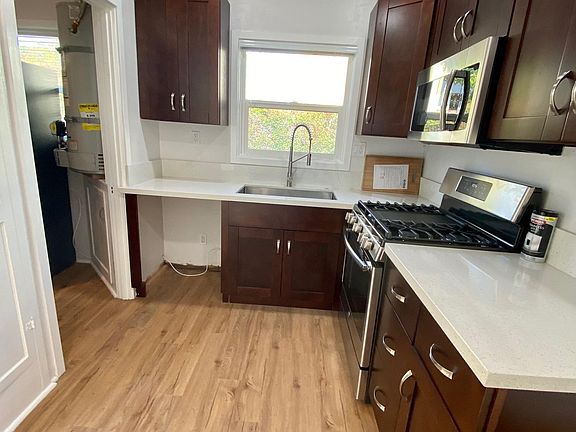 New high-end stainless appliances (Stove with griddle, dishwasher, built-in microwave and double door fridge
