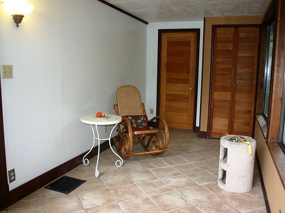Sun room, opens to the deck on the right side of home