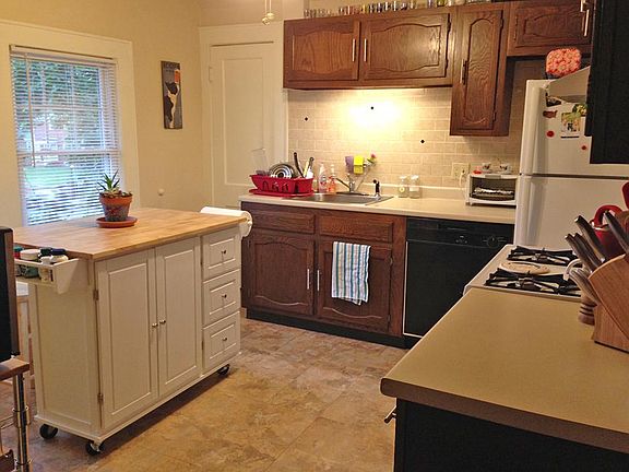Kitchen with previous tenants furnishings