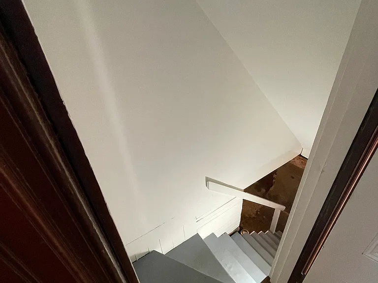 Interior kitchen door down to basement.