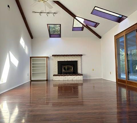 Bright living room with multiple skylights