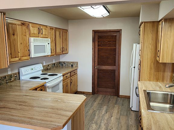 Kitchen with connected pantry/laundry/utility room