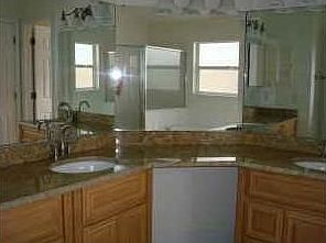 Jacuzzi bath, new granite counters, new tile floor.