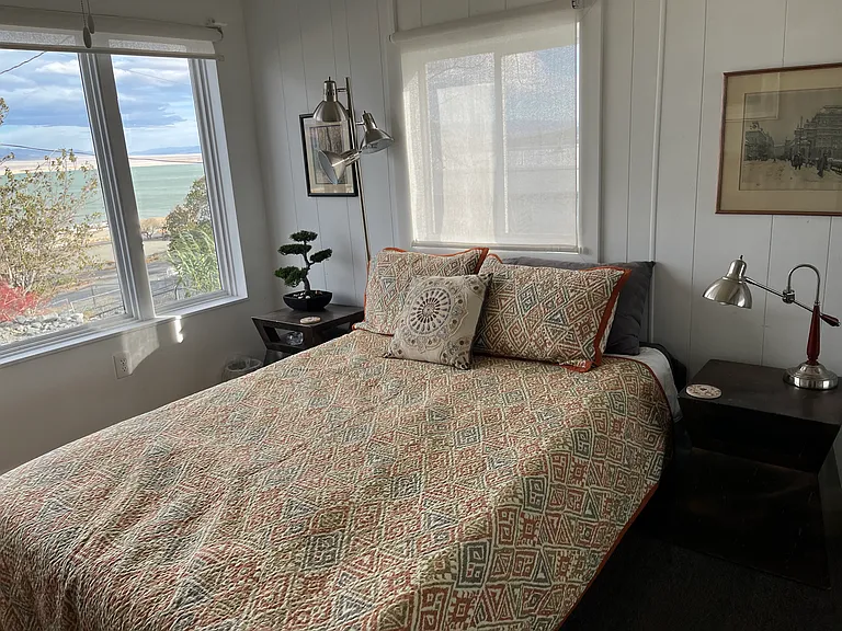 Bedroom#2 with end tables and reading lamps.