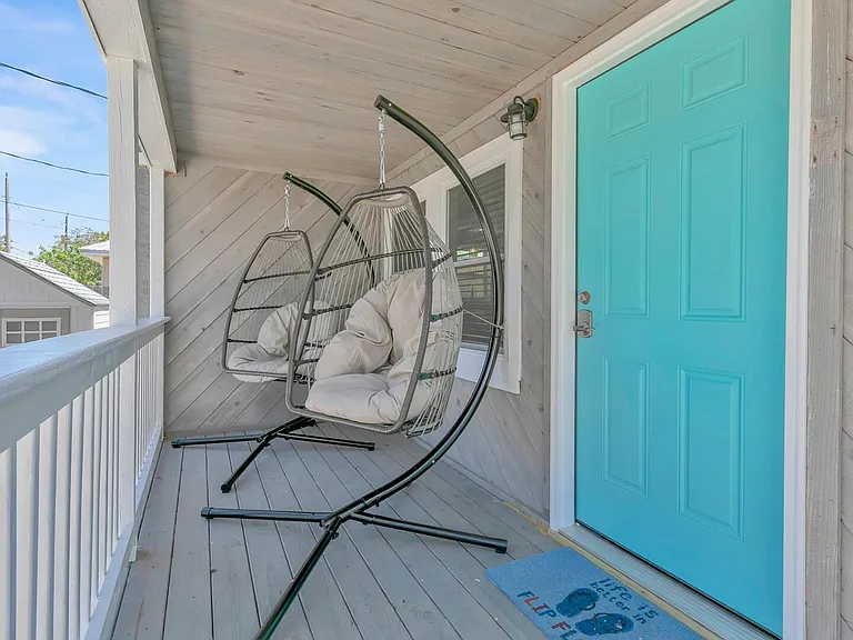 Egg swing chairs on the porch